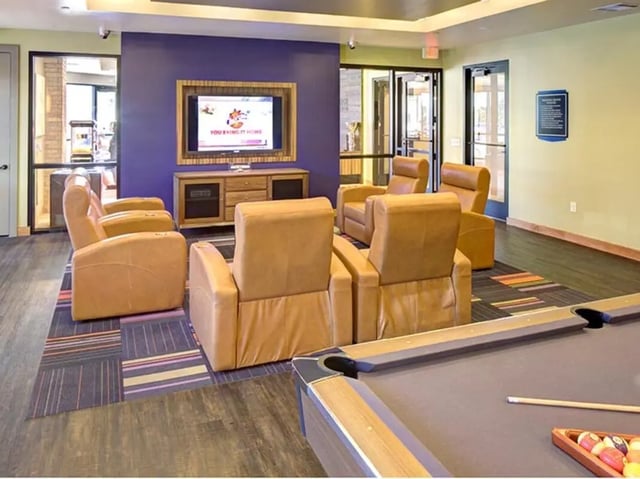 Tan recliners TV and pool table living room at Campus Edge on UTA Boulevard in Arlington Student Accommodation