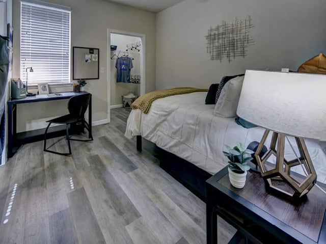 Desk chair bed closet and bedding bedroom at Campus Edge on UTA Boulevard in Arlington Student Accommodation
