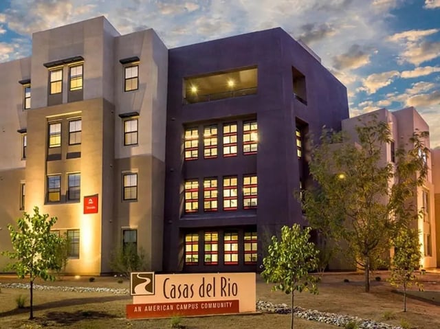 Modern apartment building with many windows exterior at Casas del Rio in Albuquerque Student Accommodation