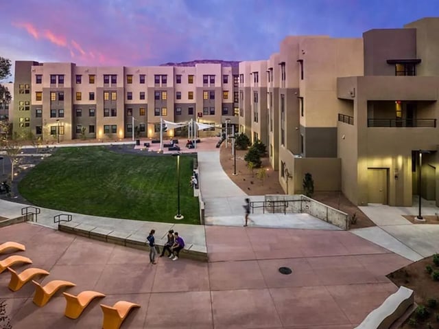 Courtyard buildings lawn seating students exterior at Casas del Rio in Albuquerque Student Accommodation