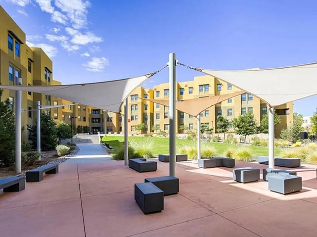 Shade structures and seating area exterior at Casas del Rio in Albuquerque Student Accommodation