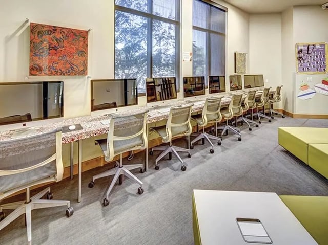 Computers chairs and artwork study area at Casas del Rio in Albuquerque Student Accommodation