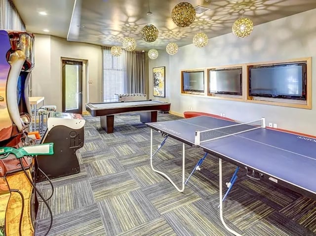 Arcade game ping pong pool table gaming area at Casas del Rio in Albuquerque Student Accommodation