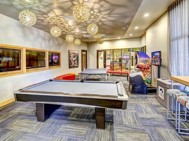 Pool table ping pong arcade gaming area living room at Casas del Rio in Albuquerque Student Accommodation
