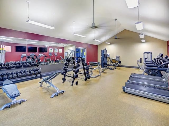 Dumbbells treadmills weight machines fitness room at Campus Edge on UTSA Boulevard in San Antonio Student Accommodation