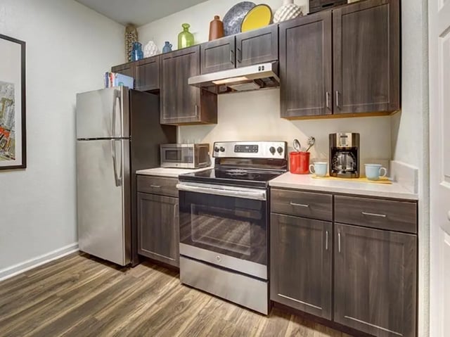 Stainless steel refrigerator stove coffee maker kitchen at Campus Edge on UTSA Boulevard in San Antonio Student Accommodation
