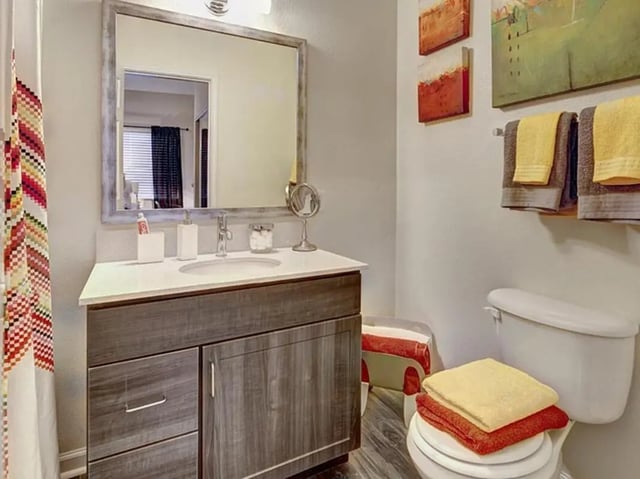 Modern vanity mirror sink toilet towels bathroom at Campus Edge on UTSA Boulevard in San Antonio Student Accommodation