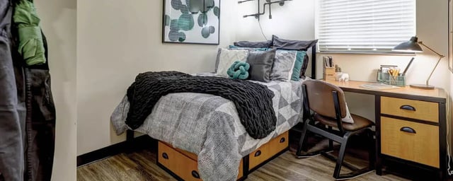 Bed desk chair and artwork bedroom at 8 1/2 Canal Street in Richmond Student Accommodation