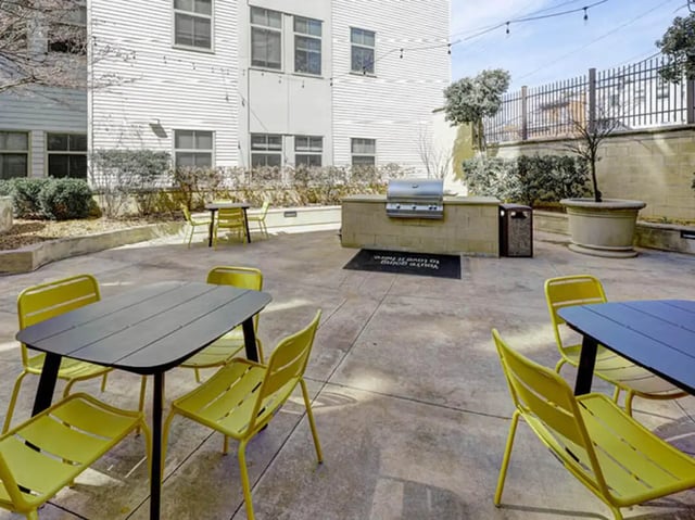 Outdoor seating area with grills patio furniture exterior at 8 1/2 Canal Street in Richmond Student Accommodation