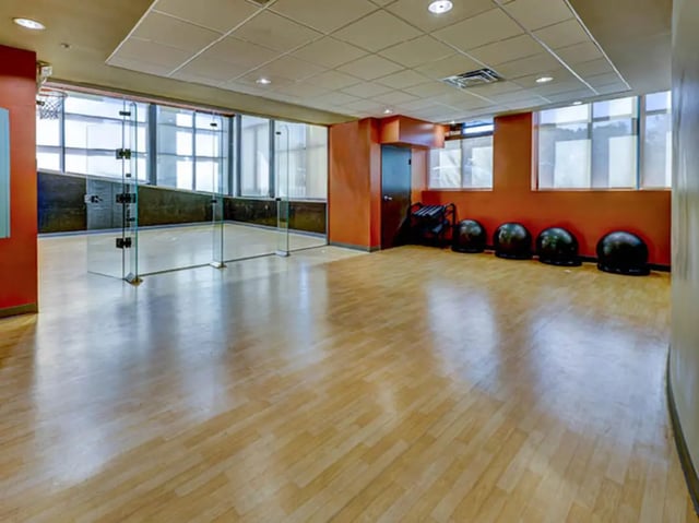 Glass enclosed court weight rack and medicine balls playing area at 8 1/2 Canal Street in Richmond Student Accommodation