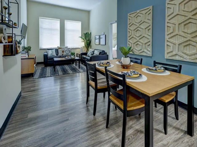 Dining table chairs living room couch and coffee table living room at 8 1/2 Canal Street in Richmond Student Accommodation