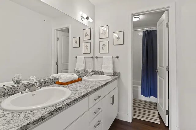 Double vanity granite countertop towels artwork Bathroom at The Lodge