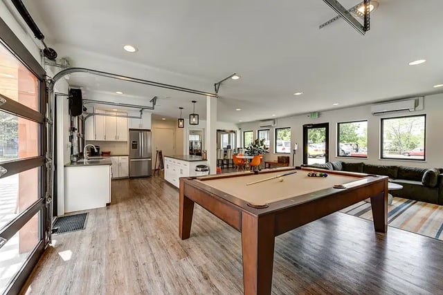 Pool table kitchen couch and dining area living room at The Lodge