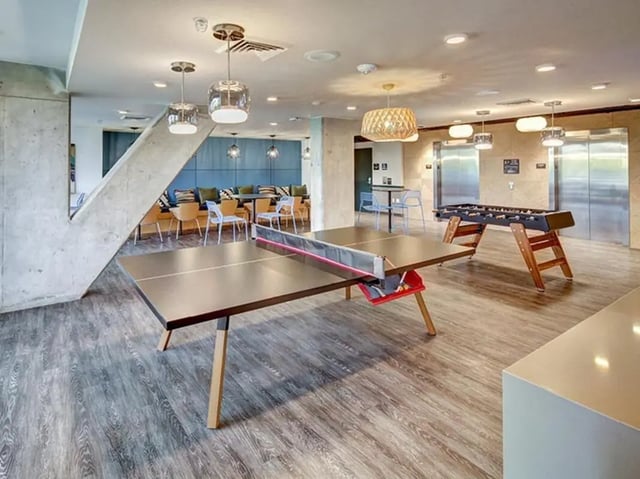Ping pong table foosball table lounge area recreation room at 959 Franklin in Eugene Student Accommodation