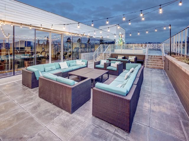 Outdoor lounge furniture with string lights exterior at 959 Franklin in Eugene Student Accommodation