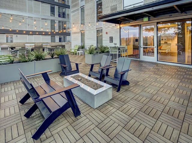 Modern patio with chairs and fire pit exterior at 959 Franklin in Eugene Student Accommodation