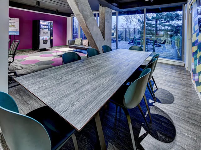 Dining table with chairs and vending machine communal area at 959 Franklin in Eugene Student Accommodation