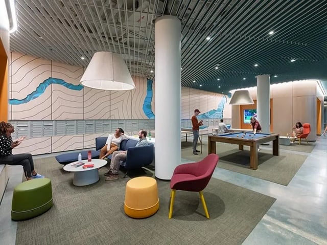 Sofa pool table seating and mailboxes lounge area at Graduate Junction in Cambridge Student Accommodation