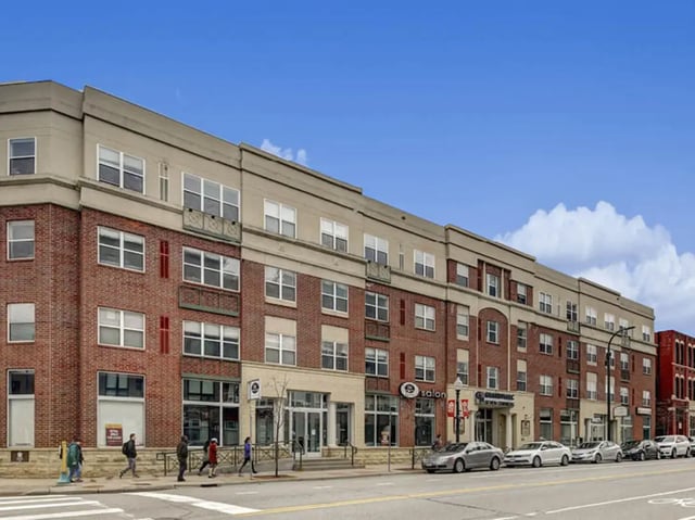 Brick building with shops and apartments exterior at GrandMarc Seven Corners in Minneapolis Student Accommodation