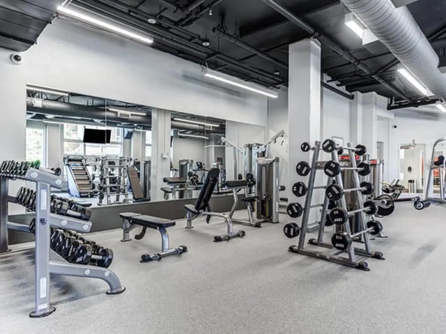 Weight rack dumbbells benches and machines gym at GrandMarc Seven Corners in Minneapolis Student Accommodation
