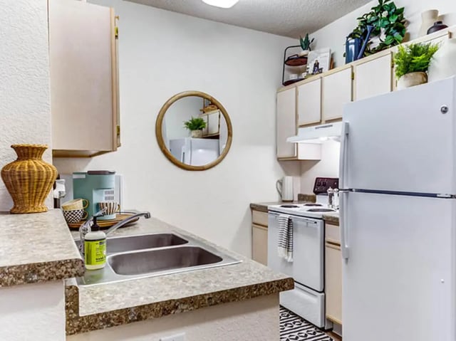 Kitchen sink coffee maker and refrigerator kitchen at GrandMarc Seven Corners in Minneapolis Student Accommodation