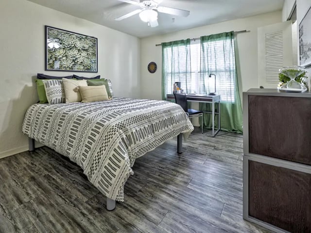 Bed desk chair curtains and artwork Bedroom at Mercury 3100 in Orlando Student Accommodation
