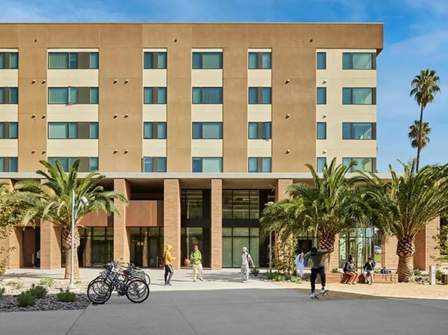 Apartment building with students and bicycles exterior at North District in Riverside Student Accommodation
