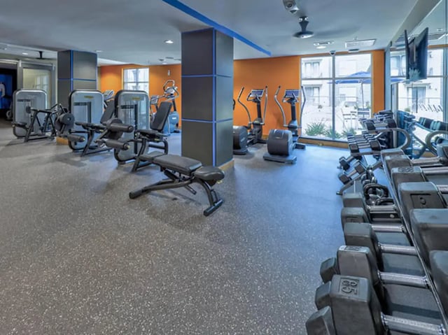 Weight machines dumbbells and elliptical machines gym at The Arlie in Arlington Student Accommodation