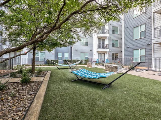 Hammocks on grass courtyard exterior at The Arlie in Arlington Student Accommodation