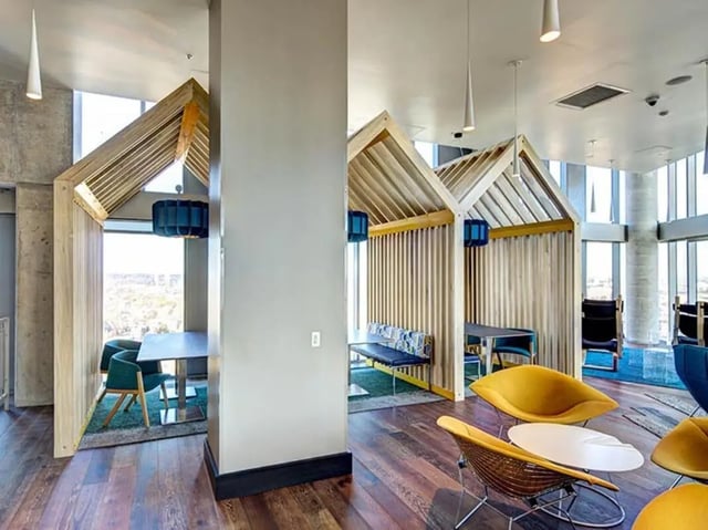Wooden cubbies with seating and tables common area at The Summit at University City in Philadelphia Student Accommodation