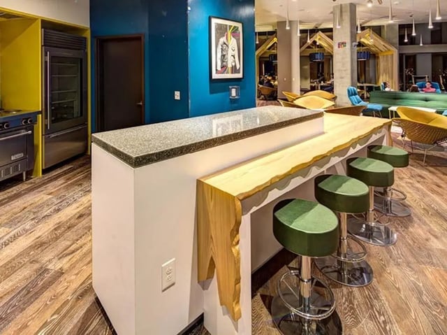 Kitchen counter with bar stools and appliances kitchen at The Summit at University City in Philadelphia Student Accommodation