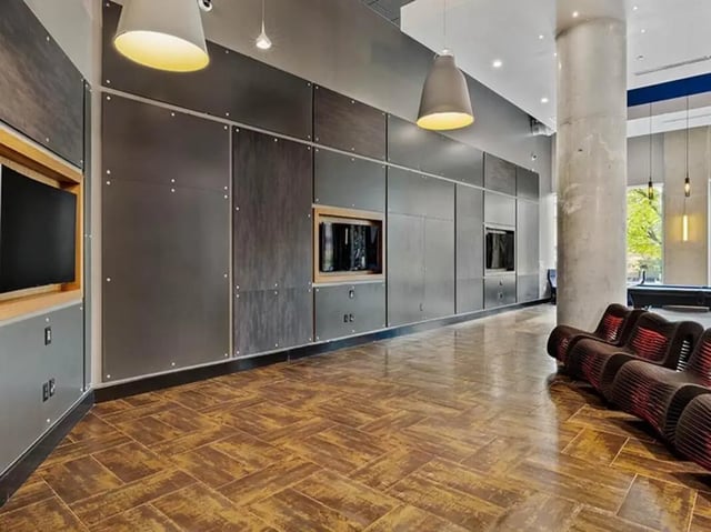 Modern lounge with contemporary seating and entertainment wall at The Summit at University City in Philadelphia Student Accommodation