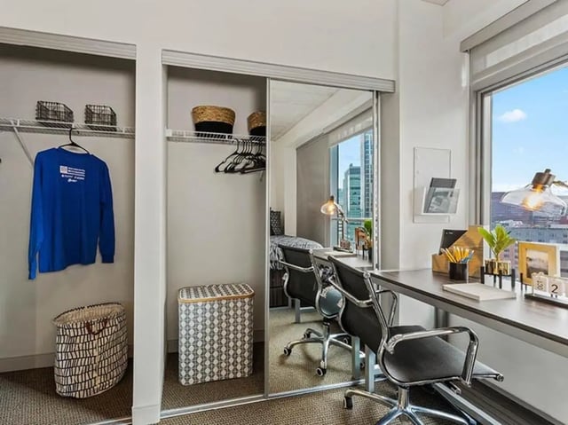 Closet desk and chairs visible bedroom at The Summit at University City in Philadelphia Student Accommodation
