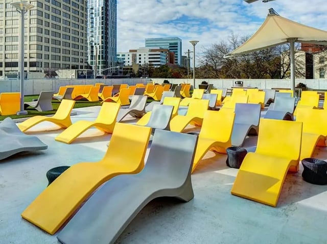 Yellow and gray chaise lounges exterior area at The Summit at University City in Philadelphia Student Accommodation