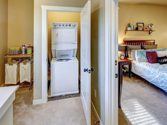 Washer dryer cart with laundry baskets and bedroom Image Type at The Cottages of Durham in Durham Student Accommodation