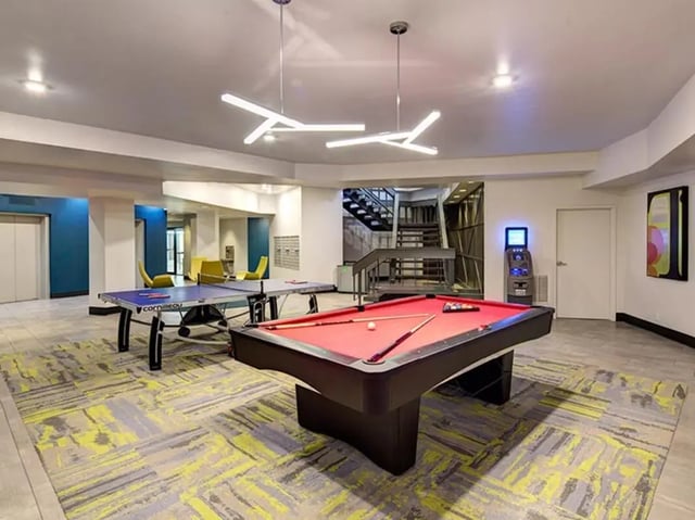 Pool table ping pong tables modern lighting gaming area at The Tower at Third in Champaign Student Accommodation