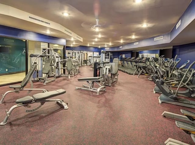 Weight machines treadmills elliptical machines gym at The Tower at Third in Champaign Student Accommodation