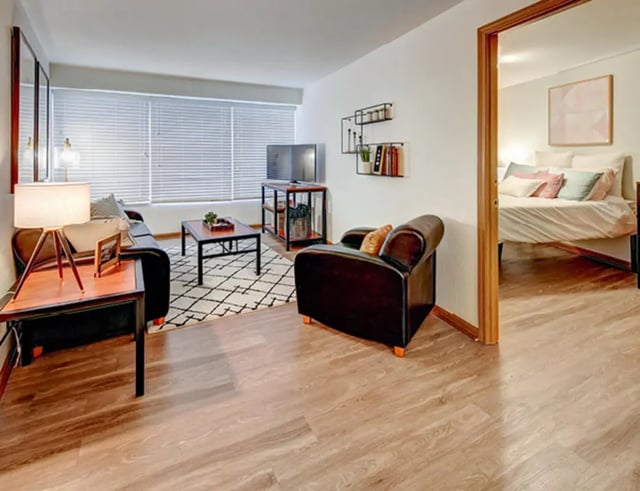 Sofa coffee table TV shelving bedroom Living Room at The Tower at Third in Champaign Student Accommodation