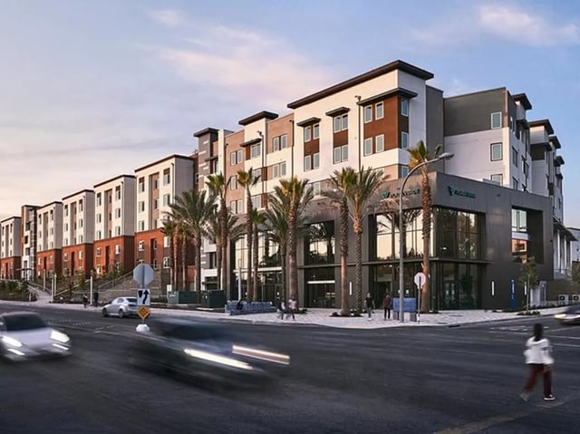 Modern apartment building with palm trees exterior at Plaza Verde in Irvine Student Accommodation