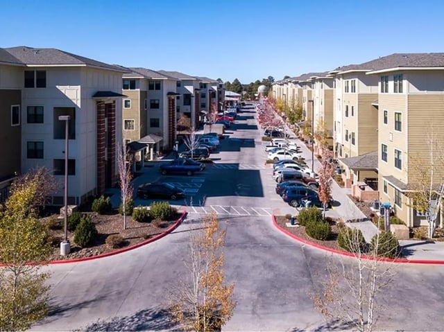 Apartment buildings with parking lots Exterior at Hilltop Townhomes in Flagstaff Student Accommodation