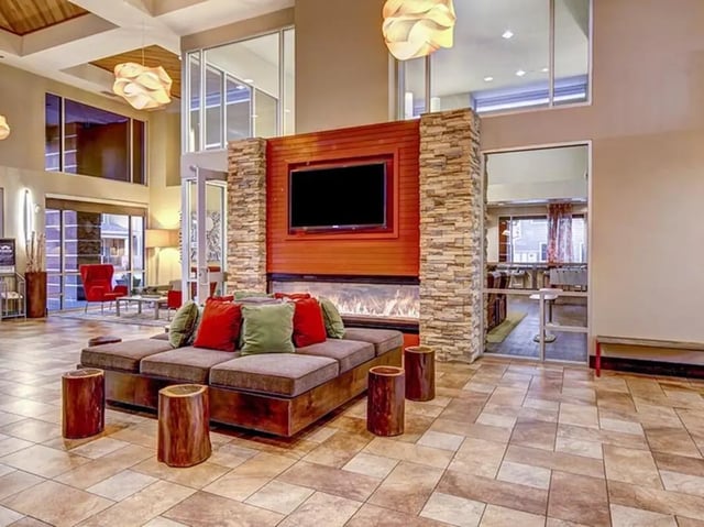 Sofa fireplace television living room common area at Hilltop Townhomes in Flagstaff Student Accommodation