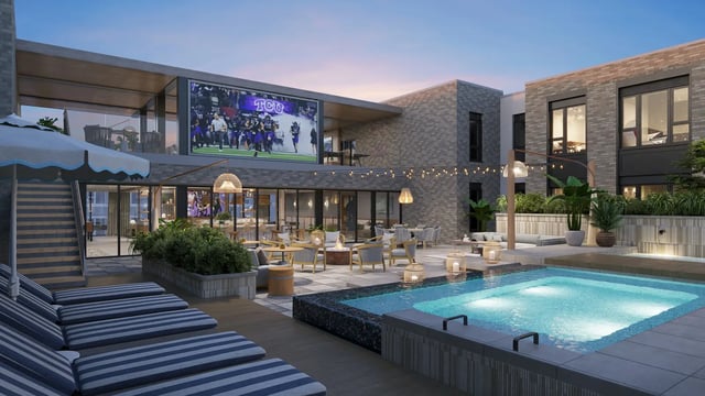 Pool lounge chairs outdoor seating large TV exterior at Morado on Berry in Fort Worth Student Accommodation