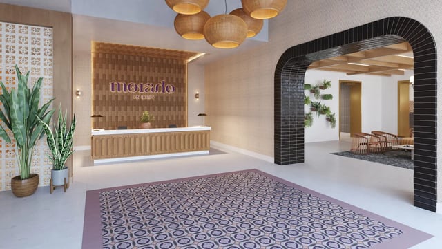 Reception desk plants and patterned rug lobby at Morado on Berry in Fort Worth Student Accommodation