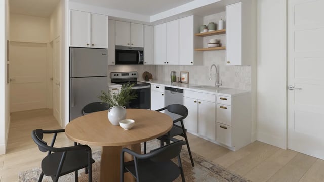 Round table, chairs, refrigerator, cabinets, sink kitchen at Morado on Berry in Fort Worth Student Accommodation
