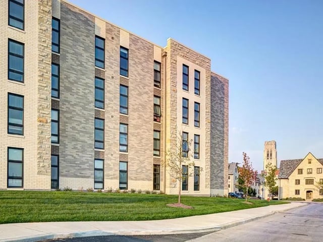 Modern brick building with many windows exterior at Honors Academic Village in Toledo Student Accommodation