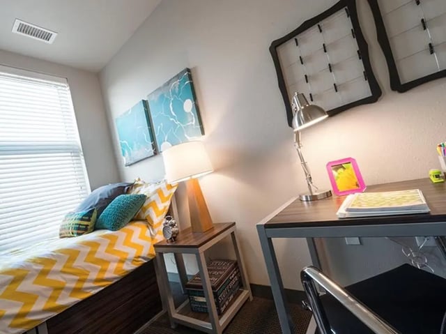 Bed side table lamp and desk study bedroom at Honors Academic Village in Toledo Student Accommodation
