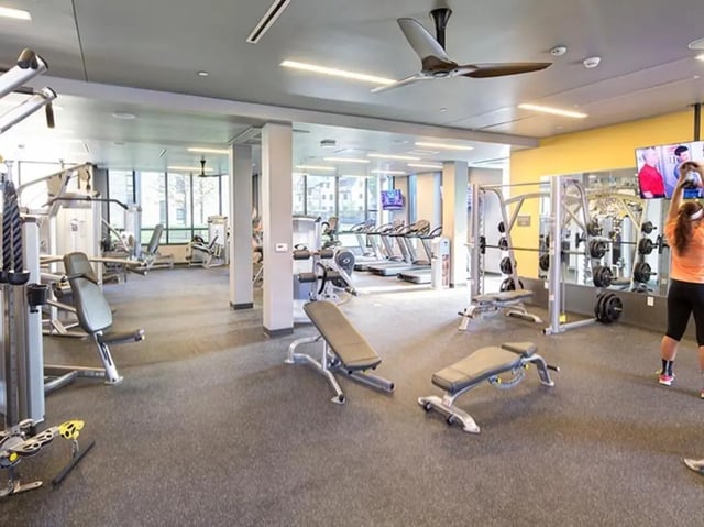 Gym equipment treadmills weight machines benches gym interior at Honors Academic Village in Toledo Student Accommodation