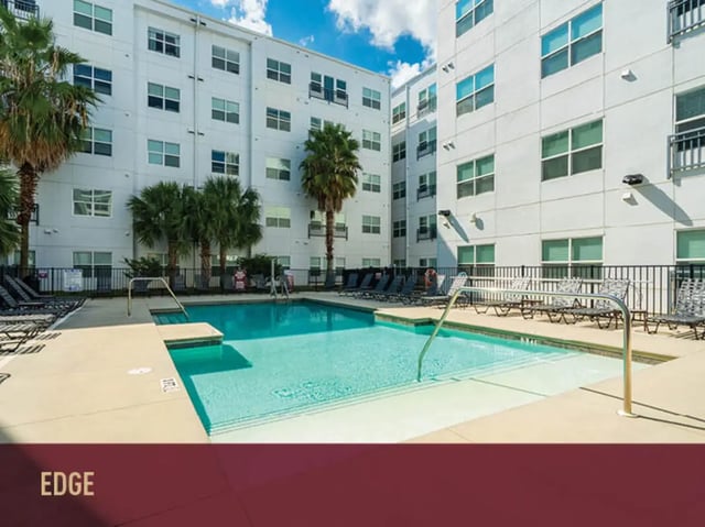 Pool with lounge chairs exterior at Stadium Centre - The Axis in Tallahassee Student Accommodation