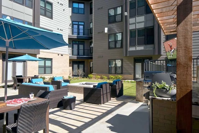 Outdoor seating with grill and television exterior at 114 Earle in Clemson Student Accommodation