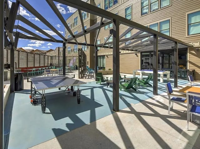 Ping pong table green chairs pool table outdoor area at The Jack in Flagstaff Student Accommodation
